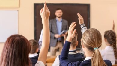 A teacher supports children in a classroom as schools call for better behavioural support for children.