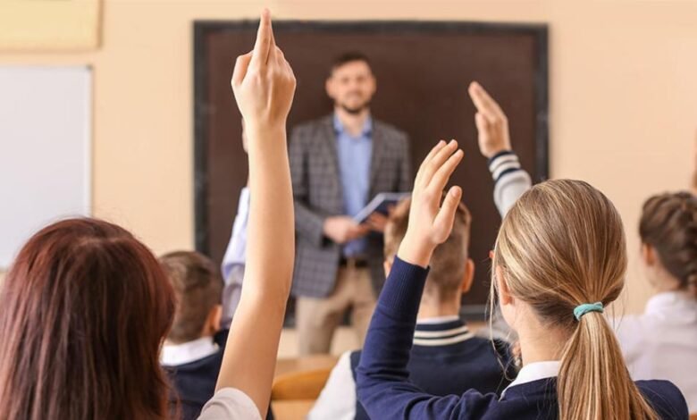 A teacher supports children in a classroom as schools call for better behavioural support for children.